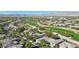 Aerial view showcasing a serene community with greenery and golf course views at 613 Pinnacle Heights Ln, Las Vegas, NV 89144