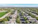Neighborhood aerial showcasing lush greenery, paved streets, and orderly housing layout at 613 Pinnacle Heights Ln, Las Vegas, NV 89144