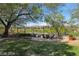 Beautiful backyard features a firepit area and well-maintained landscaping, providing a perfect outdoor retreat at 613 Pinnacle Heights Ln, Las Vegas, NV 89144