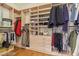 Spacious closet with wooden floors, shelving, and plenty of room for hanging and folded clothes at 613 Pinnacle Heights Ln, Las Vegas, NV 89144
