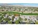 Beautiful single-Gathering home with a well-kept lawn and lush greenery in a golf community near the mountains at 613 Pinnacle Heights Ln, Las Vegas, NV 89144