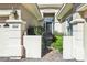 Charming front entrance with decorative iron gate, stone pillars, and a brick pathway at 613 Pinnacle Heights Ln, Las Vegas, NV 89144