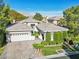 Charming single-story home with a well-manicured lawn and a two-car garage at 613 Pinnacle Heights Ln, Las Vegas, NV 89144