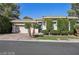 Beautiful single-story home featuring lush landscaping, palm trees, and an attached two-car garage at 613 Pinnacle Heights Ln, Las Vegas, NV 89144