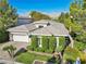 Charming single-story home with a well-manicured lawn and a two-car garage at 613 Pinnacle Heights Ln, Las Vegas, NV 89144