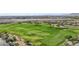 Aerial view of a long fairway with sand traps and a lush green surrounding, creating a scenic shot at 613 Pinnacle Heights Ln, Las Vegas, NV 89144