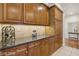 Kitchen features granite countertops, wood cabinets, and tile backsplash at 613 Pinnacle Heights Ln, Las Vegas, NV 89144