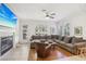 Relaxing living room area offering a sectional sofa, fireplace, and large windows at 613 Pinnacle Heights Ln, Las Vegas, NV 89144