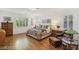 Bright main bedroom boasts hardwood floors and multiple windows at 613 Pinnacle Heights Ln, Las Vegas, NV 89144