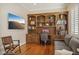 Home office featuring wood cabinets, shelving, and a tv screen hanging on the wall at 613 Pinnacle Heights Ln, Las Vegas, NV 89144
