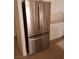 Stainless steel french door refrigerator complementing white cabinetry and quartz countertops in a modern kitchen at 6449 Elizabethtown Ave, Las Vegas, NV 89110