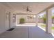 Exterior view of covered back patio with concrete flooring and ceiling fan at 6601 W Pepperidge Way, Las Vegas, NV 89108