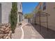 Cozy backyard featuring a walkway and trellis, perfect for outdoor relaxation and entertaining at 6601 W Pepperidge Way, Las Vegas, NV 89108