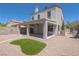 Spacious backyard featuring a covered patio and low-maintenance gravel landscaping at 6601 W Pepperidge Way, Las Vegas, NV 89108