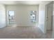 Spacious bedroom with large windows and plush carpeting at 6601 W Pepperidge Way, Las Vegas, NV 89108