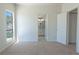 Neutral bedroom with views of the bathroom through an open door at 6601 W Pepperidge Way, Las Vegas, NV 89108