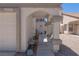 Welcoming front entrance with unique architectural details and well-kept landscaping at 6601 W Pepperidge Way, Las Vegas, NV 89108