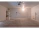 Well-lit garage featuring a water heater, electrical panel, and convenient access door at 6601 W Pepperidge Way, Las Vegas, NV 89108