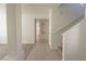 Bright hallway with tiled floors, leading to the living areas and stairs at 6601 W Pepperidge Way, Las Vegas, NV 89108