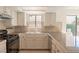 Functional kitchen with granite countertops and stainless steel appliances at 6601 W Pepperidge Way, Las Vegas, NV 89108