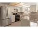 The eat-in kitchen features a stainless steel fridge, granite countertops, and updated appliances at 6601 W Pepperidge Way, Las Vegas, NV 89108