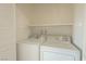 Dedicated laundry area with appliances, white cabinets, and additional storage space at 6601 W Pepperidge Way, Las Vegas, NV 89108