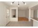 Spacious living room with fireplace, backyard access, decorative lighting, and tile/wood flooring at 6601 W Pepperidge Way, Las Vegas, NV 89108