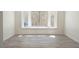 Bright living room with new flooring and a large window offering lots of natural light at 6601 W Pepperidge Way, Las Vegas, NV 89108