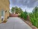 Private backyard featuring a concrete patio area and mature landscaping, perfect for relaxing outdoors at 6621 Churnet Valley Ave, Las Vegas, NV 89139