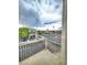 Home view from a balcony featuring gold metal railings and a view of the street at 6621 Churnet Valley Ave, Las Vegas, NV 89139