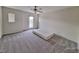 Spacious bedroom with a ceiling fan, carpet floors and balcony door, and big windows at 6621 Churnet Valley Ave, Las Vegas, NV 89139