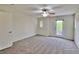 Bedroom featuring plush carpet, a ceiling fan, and a door to a private balcony at 6621 Churnet Valley Ave, Las Vegas, NV 89139