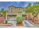 Two-story home featuring a balcony, attached garage, and a well-maintained front yard at 6621 Churnet Valley Ave, Las Vegas, NV 89139