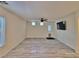 Spacious living room featuring tile floors, a ceiling fan, and a backyard door at 6621 Churnet Valley Ave, Las Vegas, NV 89139
