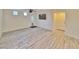 Open living room with stylish tile flooring, a ceiling fan, and access to the backyard at 6621 Churnet Valley Ave, Las Vegas, NV 89139