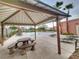 Inviting community pool area, complete with comfortable seating and shady gazebo at 6621 Churnet Valley Ave, Las Vegas, NV 89139