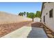 Spacious backyard with palm trees, a shed, and potential for landscaping or customization at 7404 Wittig Ave, Las Vegas, NV 89131