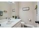 Cozy half-bath featuring a contemporary vanity, neutral color palette, and modern fixtures at 7404 Wittig Ave, Las Vegas, NV 89131