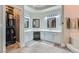 Bright bathroom with dual vanities, walk-in closet, and tiled floors providing ample space at 7404 Wittig Ave, Las Vegas, NV 89131