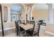 Well-lit dining area with modern lighting, decorative columns, and neutral color palette at 7404 Wittig Ave, Las Vegas, NV 89131