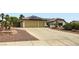 A well-kept home with a two-car garage, solar panels, and low-maintenance landscaping at 7404 Wittig Ave, Las Vegas, NV 89131