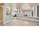 Spacious and open living spaces with tile floors, decorative columns, and seamless flow at 7404 Wittig Ave, Las Vegas, NV 89131