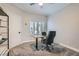 Cozy office space with neutral walls, carpet, and a bright window for natural lighting at 7404 Wittig Ave, Las Vegas, NV 89131