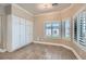 Well-lit office space featuring built-in cabinets and dual windows with shutter blinds at 7404 Wittig Ave, Las Vegas, NV 89131