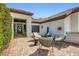 Cozy front courtyard patio featuring comfortable seating and a modern fireplace at 7404 Wittig Ave, Las Vegas, NV 89131