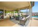 Inviting outdoor patio with comfortable seating, fire pit, heaters and view of pool area at 7404 Wittig Ave, Las Vegas, NV 89131