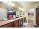 Beautiful bathroom with dual sinks, granite countertops, and a separate shower at 10042 Pipestone St, Las Vegas, NV 89141