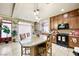 Cozy kitchen with a granite island, dark appliances, and decorative accents at 10042 Pipestone St, Las Vegas, NV 89141