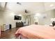 Large main bedroom with a king-sized bed, wood floors, and a ceiling fan at 10042 Pipestone St, Las Vegas, NV 89141