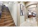 Elegant staircase with wooden steps, and a view of the living room at 10042 Pipestone St, Las Vegas, NV 89141